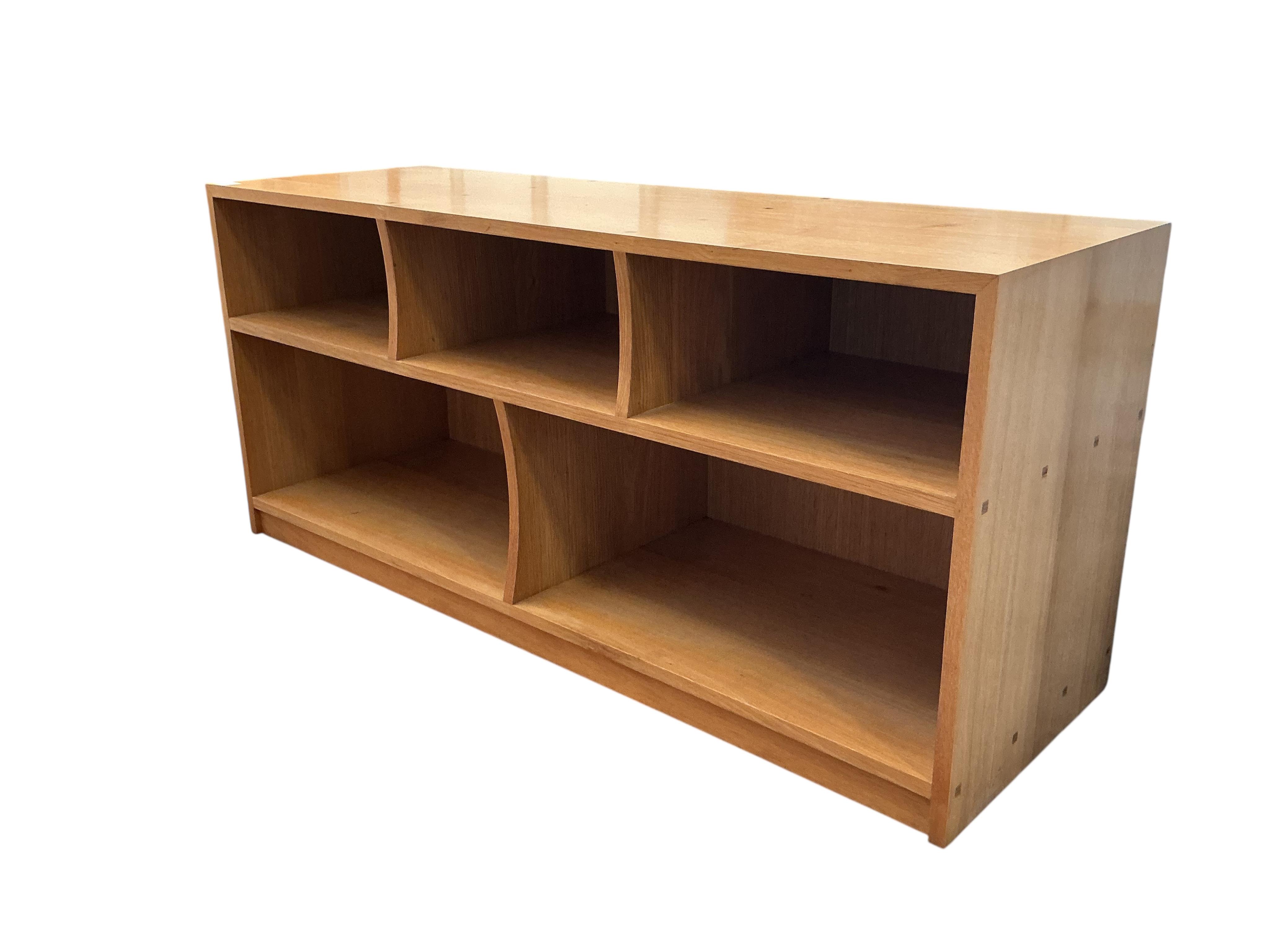 A Contemporary bespoke oak low open bookshelf, width 141cm, depth 46cm, height 63cm